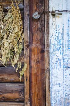 Hanging bunches of medicinal herbs. Dried herbs and flowers in the village.