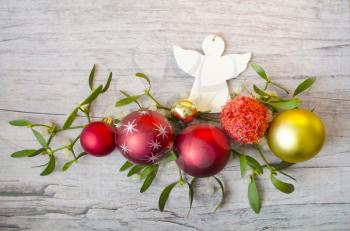 New Years and Christmas decorations with mistletoe on wooden background. Nature background