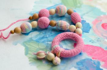Necklace made from knitted beads for the baby sitting in a sling. Knitted beads. Sling necklace.
