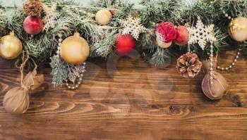 New year composition of colored balls, snowflake on a wooden texture background.Christmas photos in Rustic style with a place for the test.