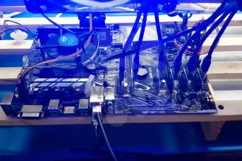 Arkhangelsk, Russia - December 27, 2017: Mining farm of several video cards. The farm is mining at home.