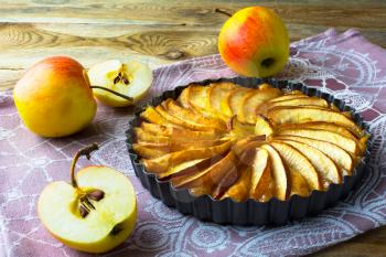 Homemade apple pie, fruit dessert, tart on wooden background, selective focus
