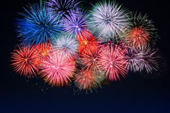 Amazing red, golden, blue fireworks. Celebration beautiful colorful fireworks. Holidays salute of various colors on night sky. 4 of July.  4th of July. Independence Day. New Year. Beautiful fireworks.
