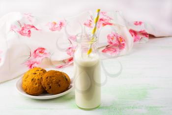 Homemade cookies and Milk bottle with straw. Breakfast cookies. Sweet pastry. Sweet dessert. Homemade cookies