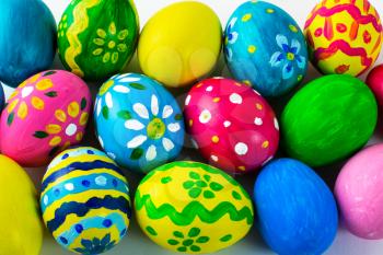Easter background of hand-painted multicolored Easter eggs. Easter symbol. Top view with copy space
