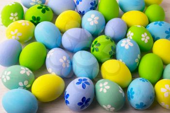 Hand-painted pastel colored Easter eggs background