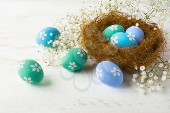 Easter eggs. Hand-painted Easter eggs in the nest. Pastel colored Easter eggs