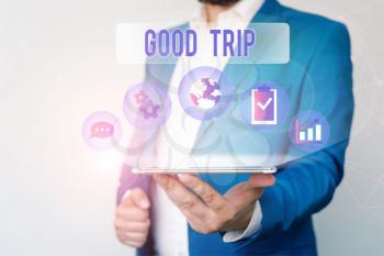 Text sign showing Good Trip. Business photo text A journey or voyage,run by boat,train,bus,or any kind of vehicle Male human wear formal work suit presenting presentation using smart device