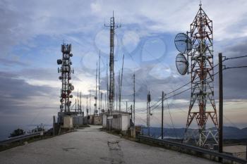 Plenty of radio masts located on the hilltop wit antennas. Radio masts and towers are tall structures designed to support antennas for telecommunications and broadcasting, including television.