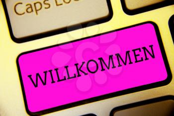 Text sign showing Willkommen. Conceptual photo welcoming people event or your home something to that effect Keyboard purple key Intention create computer computing reflection document