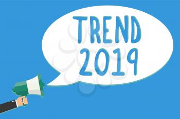 Text sign showing Trend 2019. Conceptual photo things that is famous for short period of time in current year Man holding megaphone loudspeaker speech bubble message speaking loud