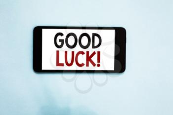 Text sign showing Good Luck. Conceptual photo A positive fortune or a happy outcome that a person can have Cell phone white screen over light blue background text messages apps