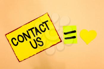 Conceptual hand writing showing Contact Us. Business photo text Group of person that rendering costumer service through telecom Yellow paper reminder equal sign heart sending romantic feelings