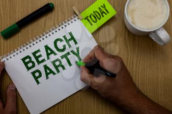 Conceptual hand writing showing Beach Party. Business photo showcasing small or big festival held on sea shores usually wearing bikini Man holding marker notebook reminder wooden table cup coffee