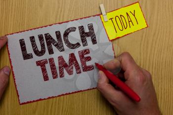 Word writing text Lunch Time. Business concept for Meal in the middle of the day after breakfast and before dinner Man holding marker paper clothespin reminder express ideas wooden table