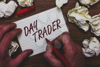 Handwriting text writing Day Trader. Concept meaning A person that buy and sell financial instrument within the day Man holding marker notebook page crumpled papers several tries mistakes