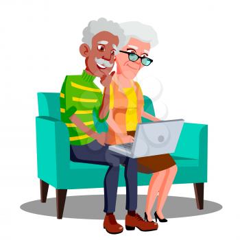 Multi Ethnic Couple Sitting On The Couch With Cup And Laptop Vector. Illustration