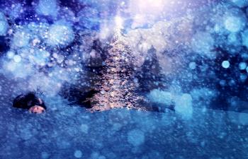 Abstract colorful winter background with falling snow.