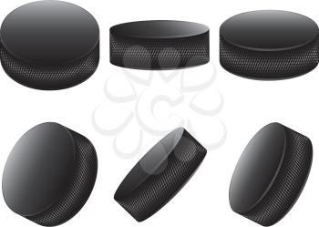 Collection of ice hockey pucks on white background.