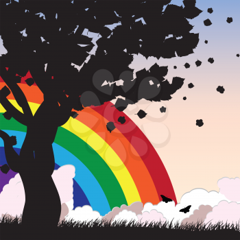 Silhouette of a tree over background with rainbow and clouds.