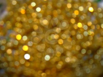Abstract golden blurred background with bokeh effect.