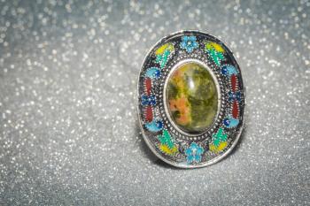 Decorative silver ring with unakite stone and enamel.