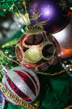 Colorful decorations on Christmas tree, holiday background.