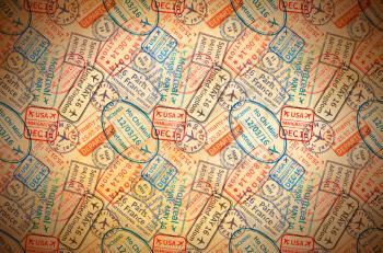 A lot of colorful International travel visa rubber stamps imprints on old paper, horizontal vintage background