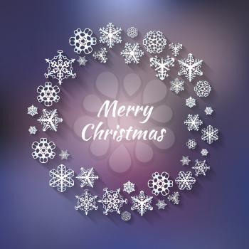 Wreath of snowflakes on the winter background with Christmas greetings