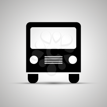 Bus silhouette, front view simple black icon with shadow