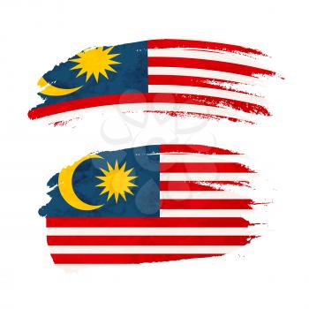 Grunge brush stroke with Malaysia national flag isolated on white