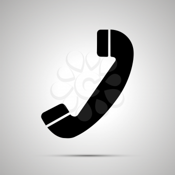 Handset silhouette, simple black phone icon with shadow