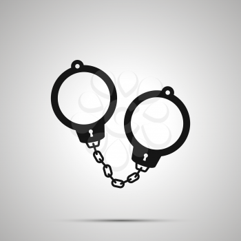 Police handcuffs, simple black icon with shadow on gray