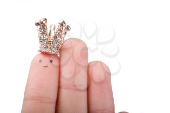 Finger with dots like a face and a crown on the top