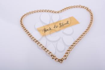 Chain forms a heart shape with a title back to school in it
