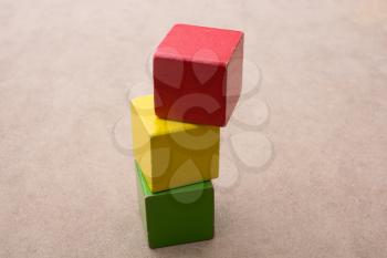 Colorful building  blocks on a brown background