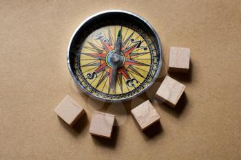 Wooden cubes Magnetic compass tool as a concept of traveling