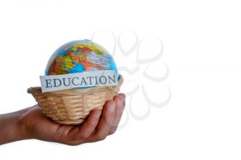 education in one hand and globe in one hand in a basket
