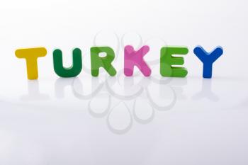the word TURKEY  written with colorful letter blocks