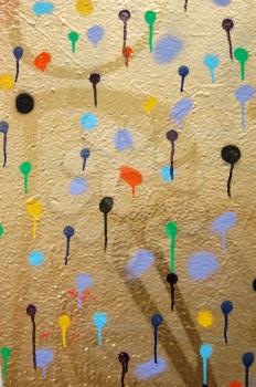 Detail of a wall covered with dots. Dripping paint. Graffiti street art.