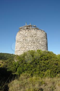 Old stone windmill ruins in Zakynthos, Greece.