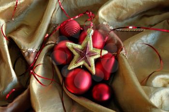 Christmas baubles, red heart and golden star. Seasonal background.