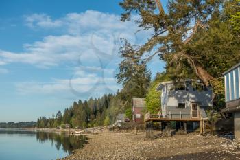 A view of homes on Hood Canal in Wahsinton State  at low tide.