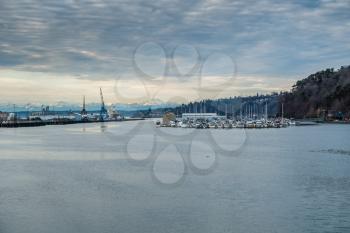 A veiw of  a Tacoma marina with the Olympic Mountains in the distance.