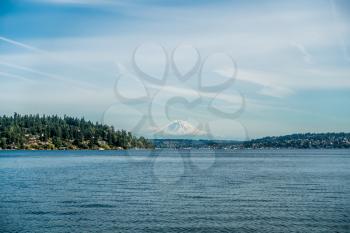 Mount Rainier can be seen in the distance with Lake Washington  in the foregrund. Mercer Island is on the left. Shot taken at Seward Park.