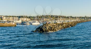 A view of the rock jetty and marina in Des Moines, Washington.