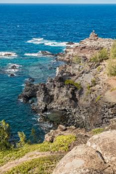 Aview  of a rocky shoreline on the Northwest area of Maui, Hawaii.