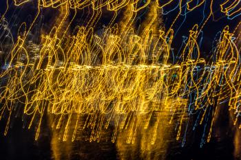 Lights at the Des Moines Marina make abstract waves. Shot taken at slow shutter speed with a flip of the wrist.