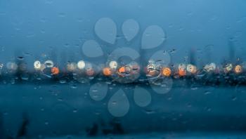 Rain on a window creates an abstract image.
