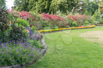 A view of a lawn and flower garden at Point Defiance Park in Tacoma, Washington.
